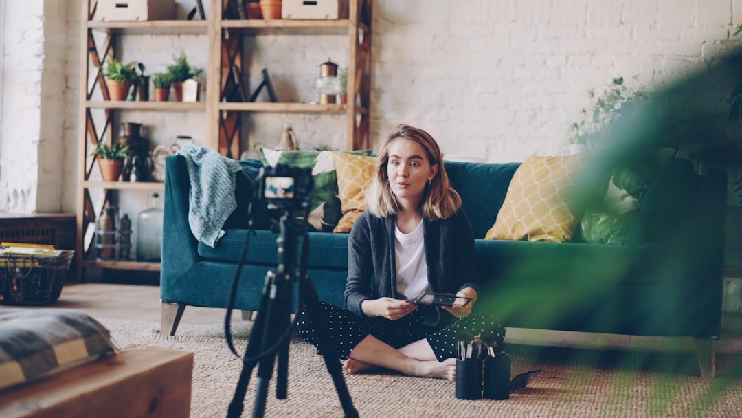 Student learning visual storytelling with camera equipment in a workshop