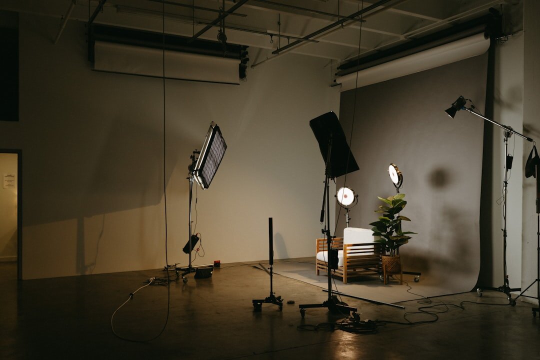 Professional video journalism production setup with broadcast cameras and lighting