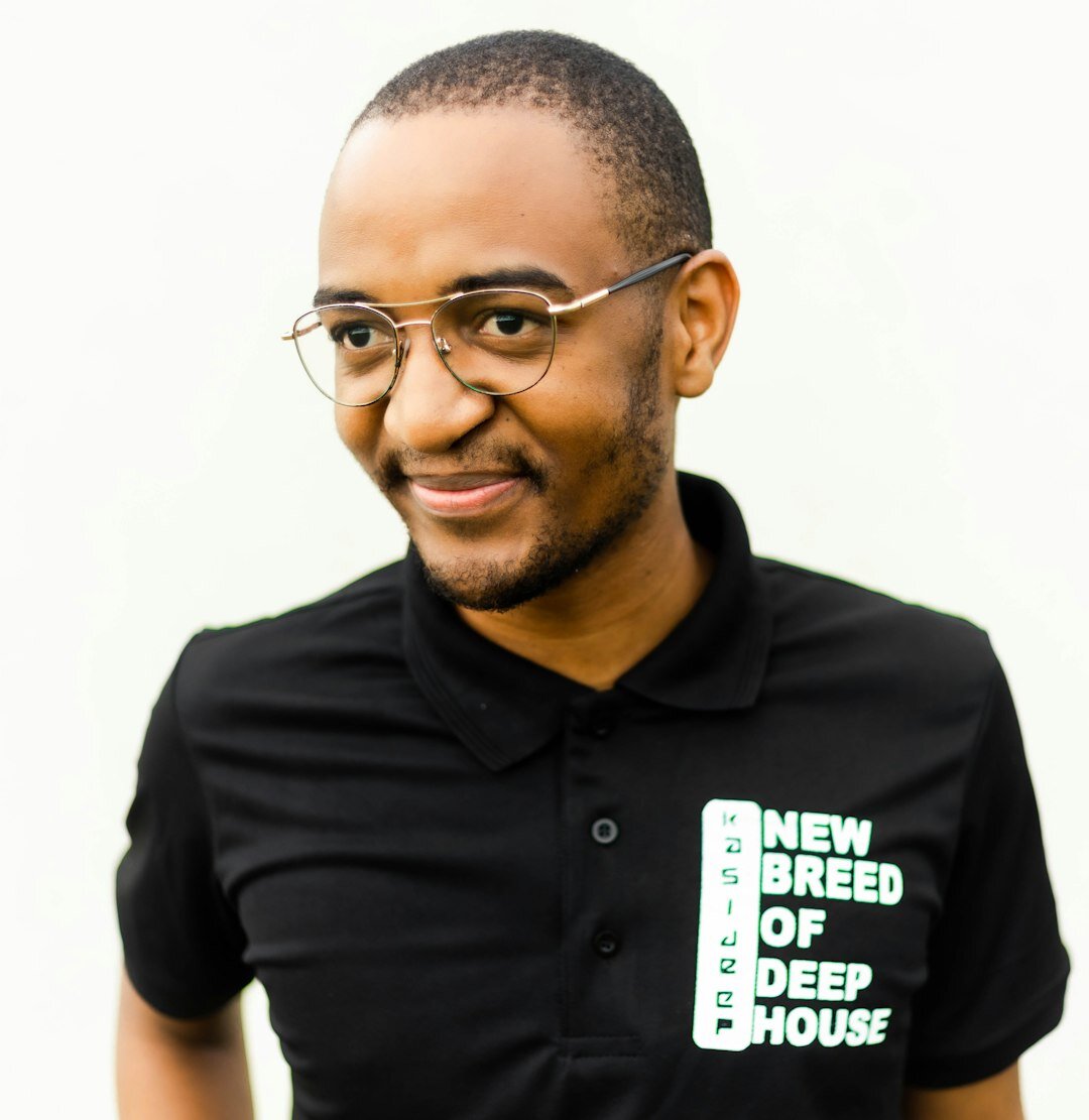 Professional male journalism instructor with glasses smiling