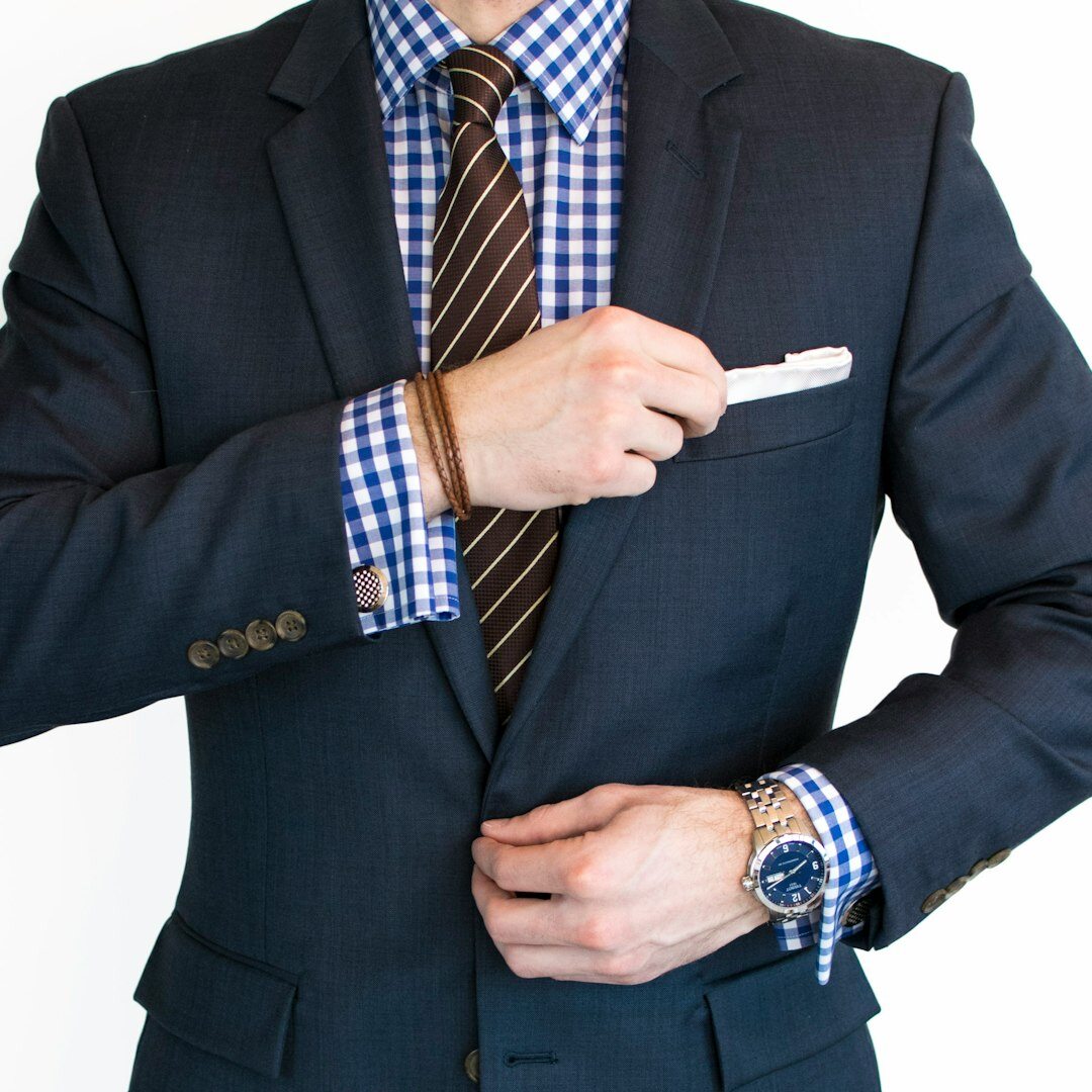 Senior journalism professor and media expert in a suit